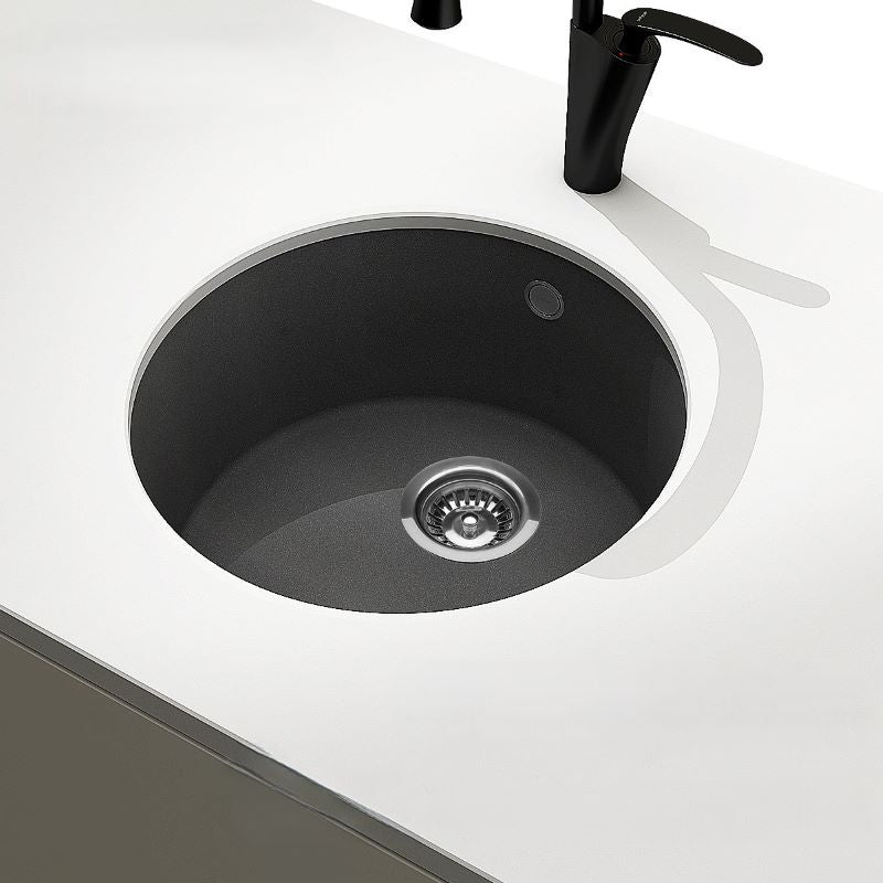 Round quartz kitchen sink used in minimalist island kitchens